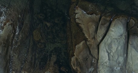 top view of sea water and rocks of beach. whild beach