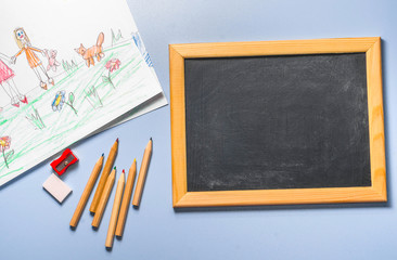 Children's drawing, colored pencils and chalk board, top view