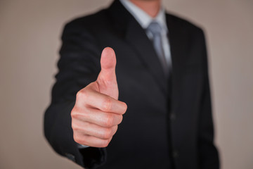 Businessman give a thumbs up for compliment as praise, congratulate, good and like concept. - obrazy, fototapety, plakaty