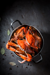 Preparation for tasty crab with allspice and bay leaf © shaiith