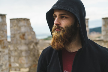 Bearded man in hood