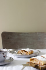 Strudel with apple-pear filling, served with tea. Traditional Austrian dessert.