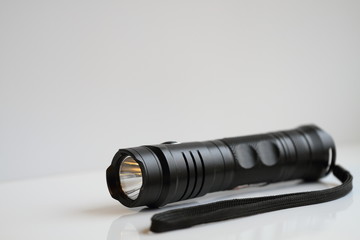 Manual black flashlight, reliability, quality, shine