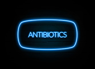 Antibiotics  - colorful Neon Sign on brickwall