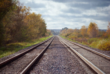 Fototapeta na wymiar Railway, two railroad tracks goes parallel, horizontal shot