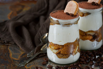 Italian dessert tiramisu on an old grunge background