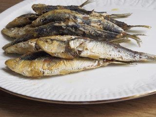 Fried small sardine on a plate