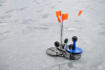 Winter fishing for pike on the imitation fish. Tackle for winter fishing