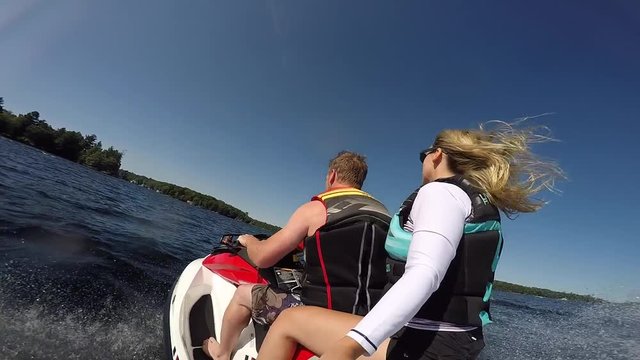 seadoo jumping boat wake wave slow motion guy and girl