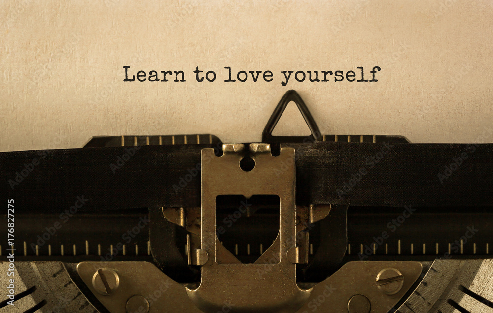 Poster text learn to love yourself typed on retro typewriter