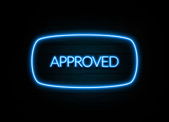 Approved  - colorful Neon Sign on brickwall