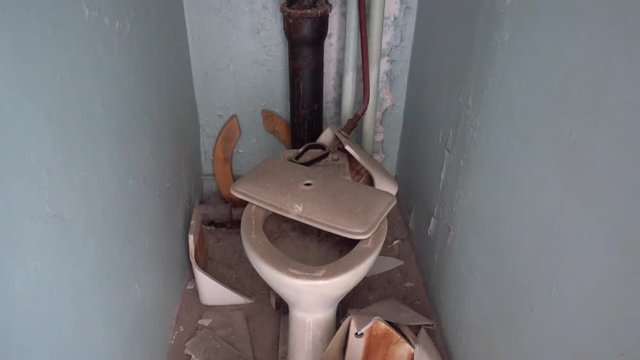 Chernobyl zone, Ukraine - 18th of June 2017: Visit to Pripyat Ghost Town - 4K Destroyed bathroom in one of Pripyat residential houses