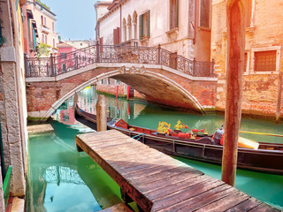 Lovely hidden venetian chanal with gondola in Venice