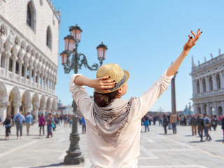 Young female traveler enjoying beautiful view on the Piazza San Marco, Venice
