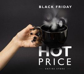 Banner for Black Friday sale - female hand with black nails holding a big, black, steaming cup....