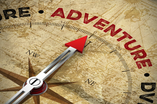 Kompass zeigt auf das Wort Adventure / Abenteuer