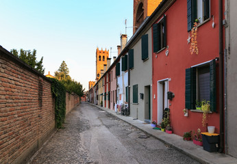 Fototapeta na wymiar Montagnana, Italy - August 6, 2017: architecture of the quiet streets of the old city in the early morning.