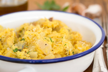 codfish with egg and herbs on white dish