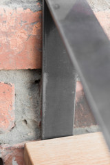 Shelf in wood and metal hanging on a brick wall in loft style