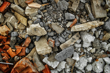Construction garbage background. Fragments of bricks, broken tiles and pieces of plaster