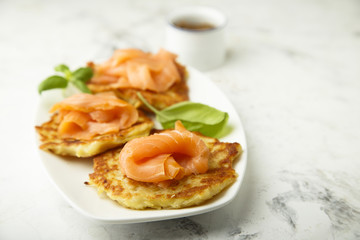 Obraz na płótnie Canvas Potato pancakes with smoked salmon