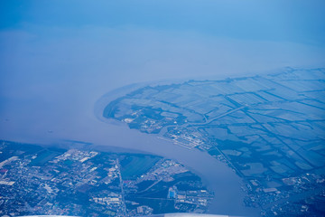 Aerial view over river the mouth with salt-field in Bangkok, Thailand.