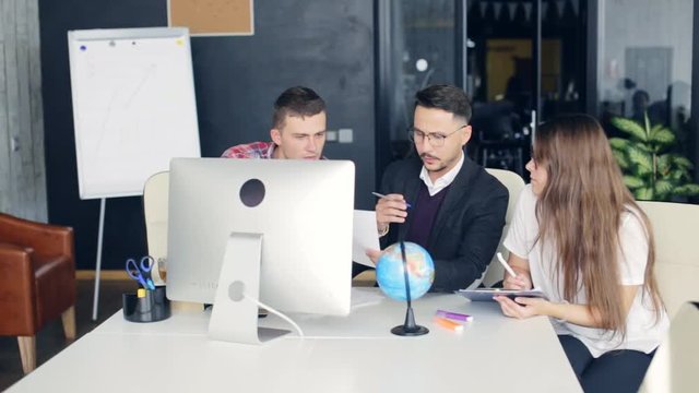 Business coworkers discussing new ideas and brainstorming in a modern office