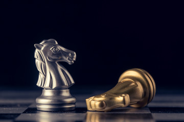 Chess on a chessboard at black background, Business leader concept. vintage tone.