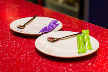empty saucer with a spoon for tea