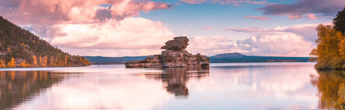 Beautiful morning landscape. Borovoe lake and stone sculprure Jumbaktas, Burabay National park in Northern Kazakhstan.