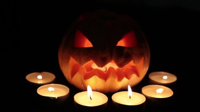 Holiday Halloween. Pumpkin Jack with candles. All Saints' Day.