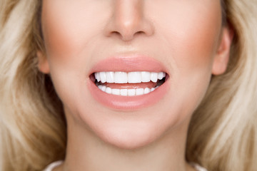 Portrait of a beautiful, smiling woman with  white teeth