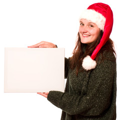 Attraktive Frau mit Nikolausmütze und Schild 