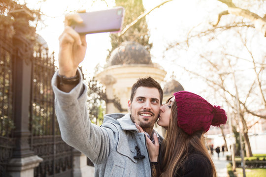 couple taking selfie in the street