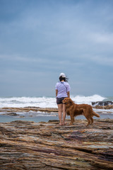 Woman and Golden Retriever at the beach