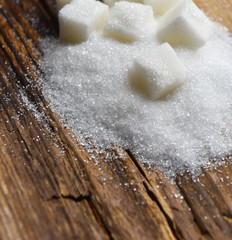 refined sugar sand on a textured wooden Board