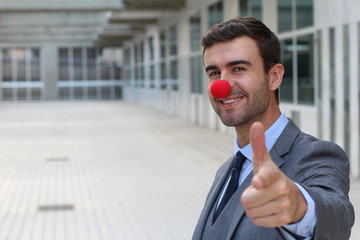 Clownish businessman pointing at you 