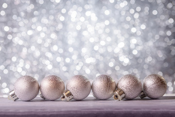 Christmas decorative balls against abstract background