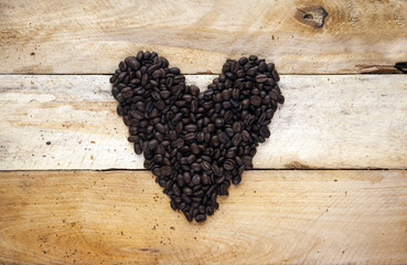 Coffee bean heart shape - concept for loving caffeine, coffee