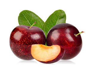 red cherry plum with green leaves isolated on white background