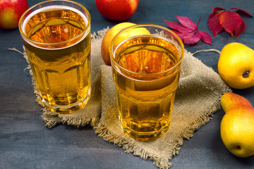 Cider with fruits. Glasses of cider with apples and pears. Food and drink concept, horizontal