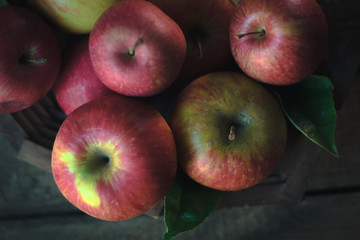 Fresh ripe apples on a wooden background. Autumn still life.