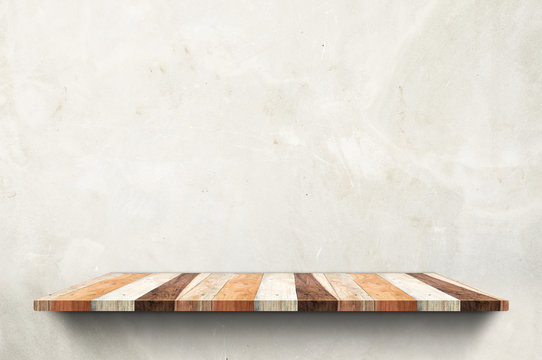Empty wood board shelf at concrete wall background,Mock up for display or montage of product or design.