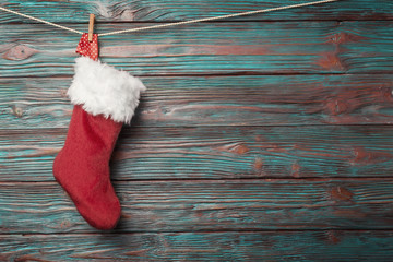 Christmas sock over rustic wooden background