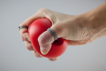 Hand and fingers rehabilitation exercises with a small ball