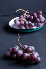 Black grapes on a black background