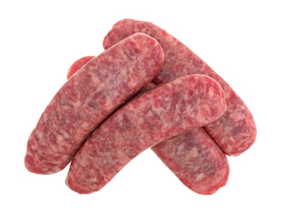 Top view of several mild bratwurst sausages isolated on a white background.