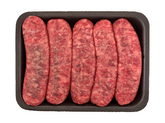 Top view of mild bratwurst sausages in a black foam butchers tray isolated on a white background.