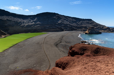 volcanic crater and green lake at El Golfo, Lanzarote, Canary islands, Spain - 176848442