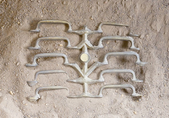 Metal casting - Fresh handles cooling down in the sand